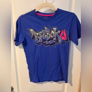Reebok size 10/12 girls tshirt blue with spray paint type graphic